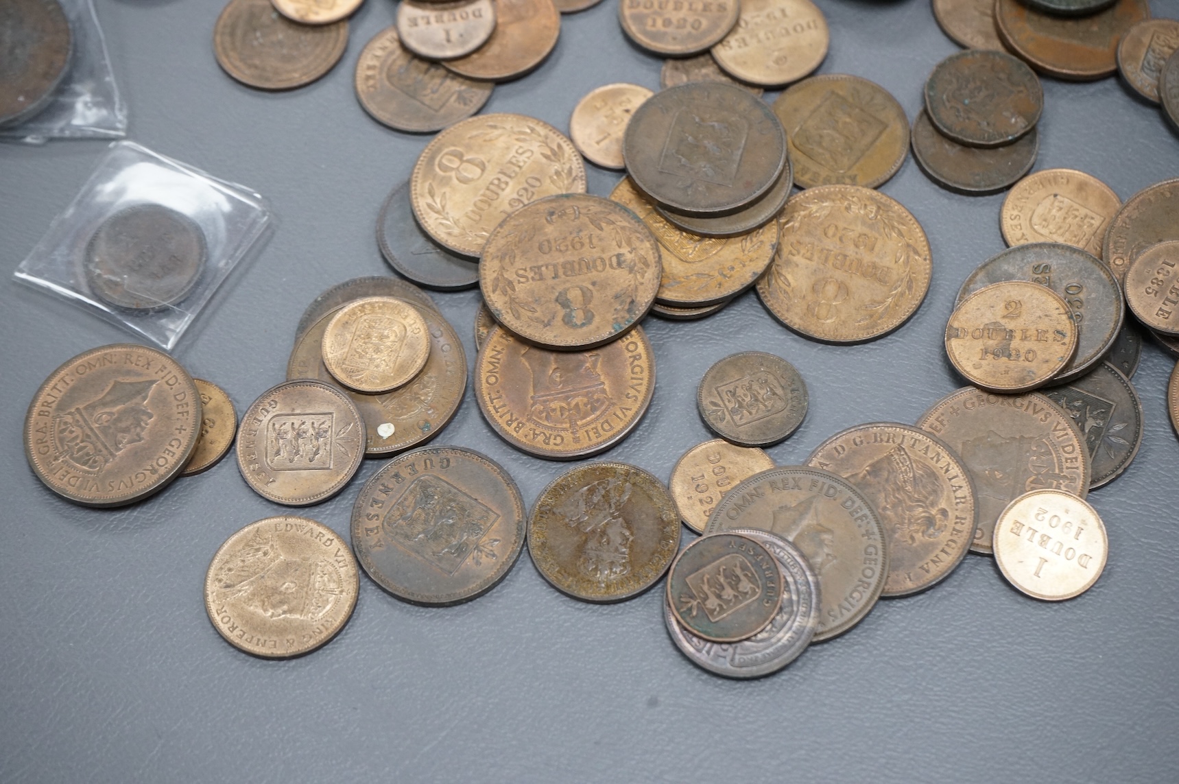 A collection of Guernsey and Channel Islands coins, Victoria to George V, many EF to UNC, Together with a C. Brooke rajah Sarawak, one cent, 1870, about EF